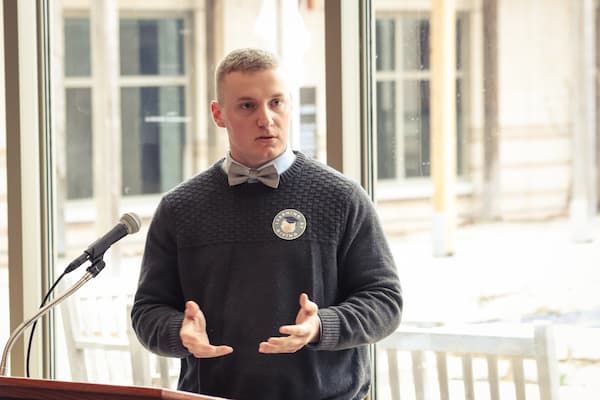 Male students gives speach at strategic philanthropy event