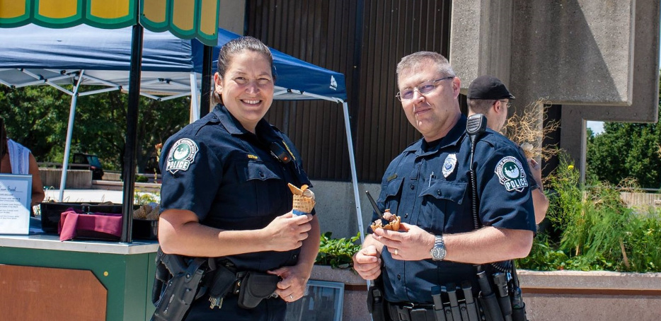 Two officers eating ice cream