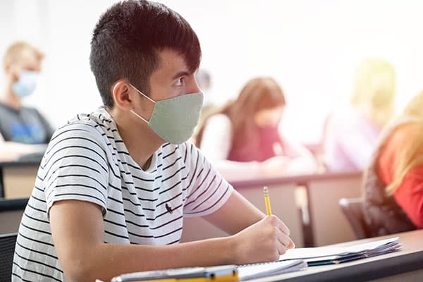 Student taking notes during class