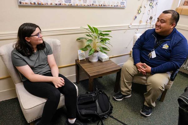 UW-Green Bay Master program graduate meets with child