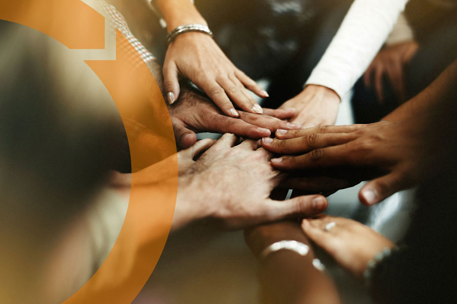 multicultural hands joining together