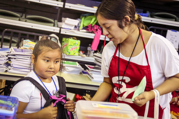 Child visits community back to school store