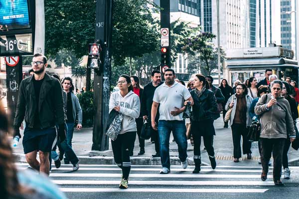 People crossing a crosswalk in a large city