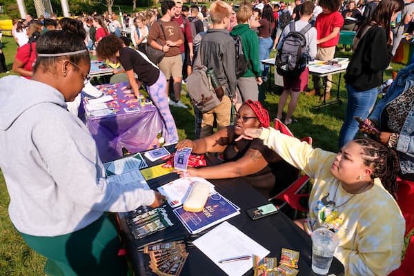 Black Student Union sign up a new member during OrgSmorg at Phoenix Park