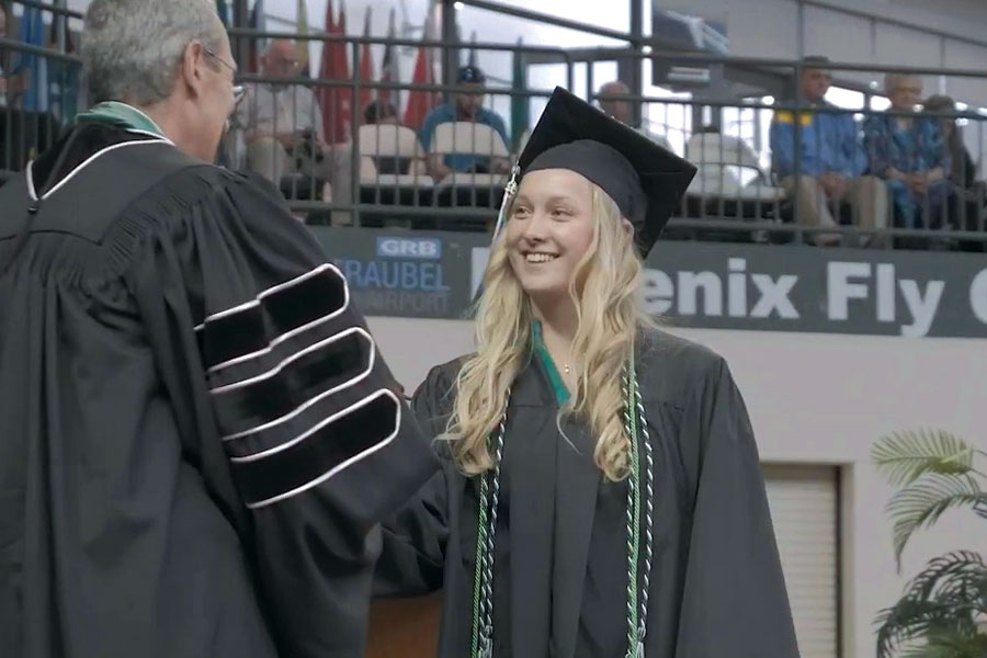 Emilie Popp recieving her diploma at graduation.