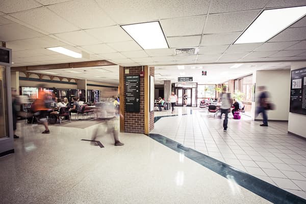 Long exposure of students walking through tunnels