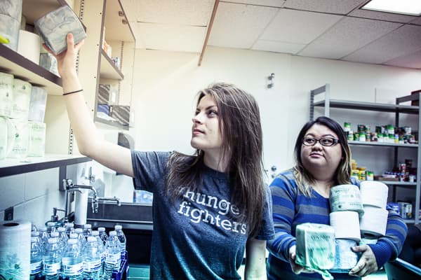 Students volunteering in the campus cupboard pantry