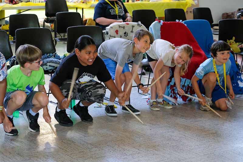 campers drumming on floor