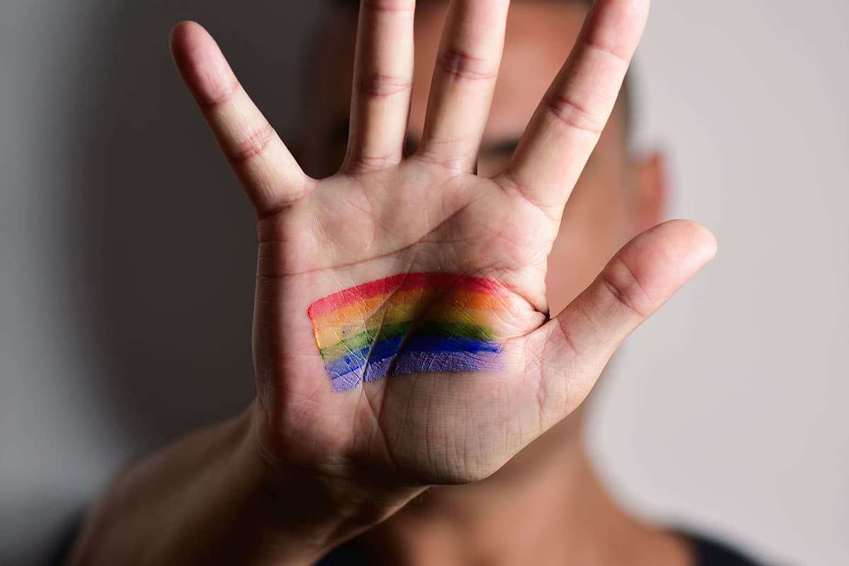 Pride flag on a hand