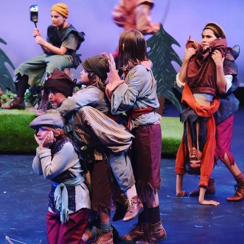 Campers acting on stage in costume