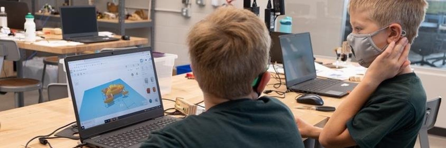 Image of kids designing on a computer