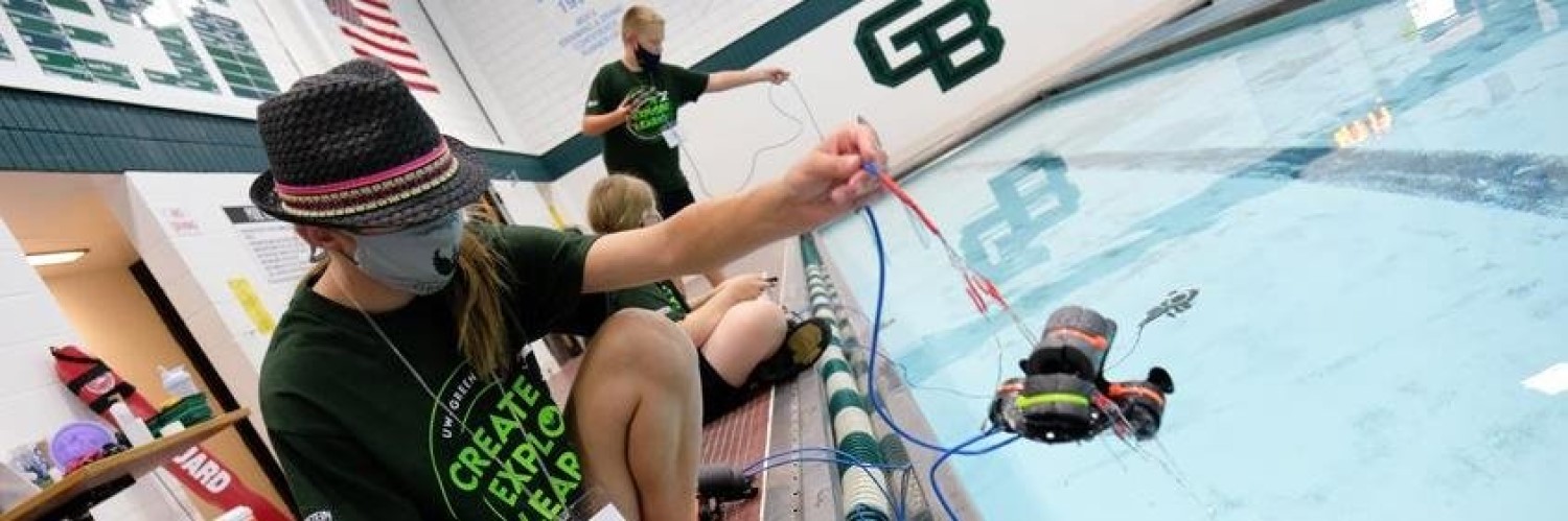 Image of kids playing with water robots