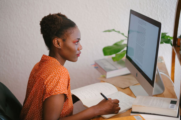 African american student attends class online