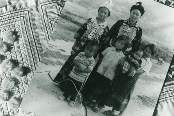 Hmong family posing for photo after fleeing Laos and moving to America