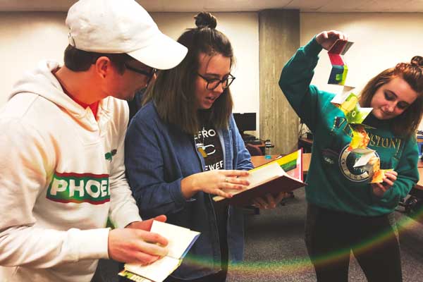 Students look at different kinds of book binding