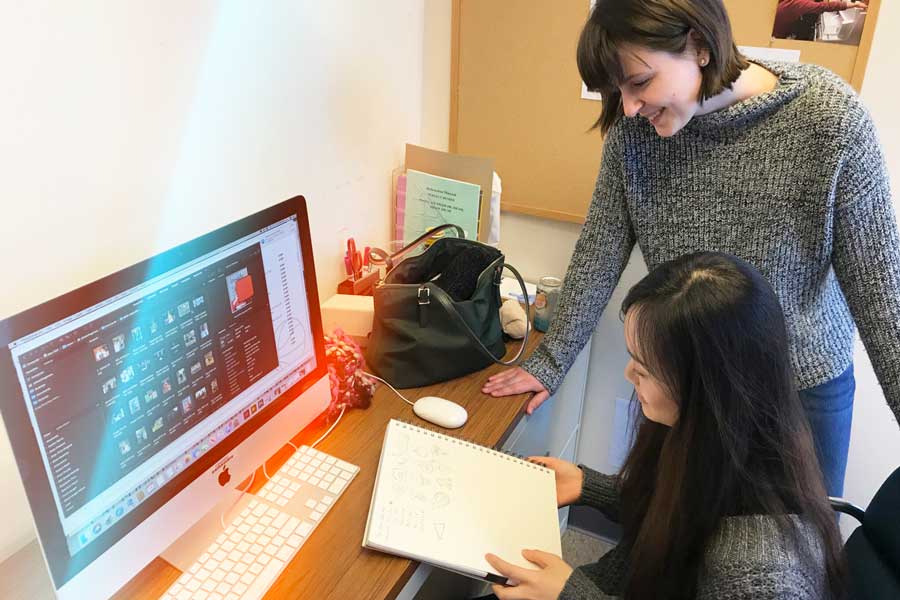 Students work on illustrations at computer