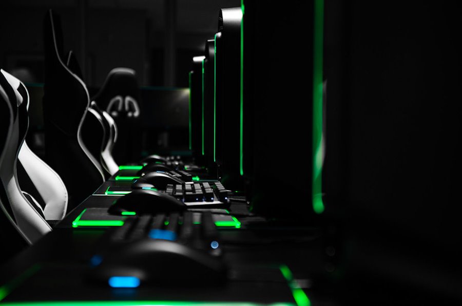 Esports PCs, keyboards, and mice lit up in green