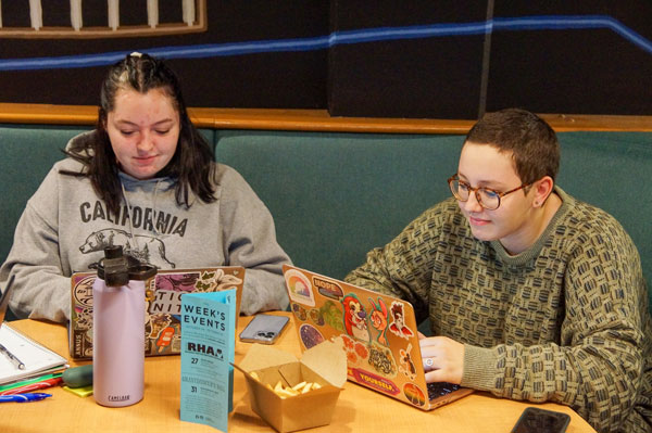 Two students studying in the Phoenix Club