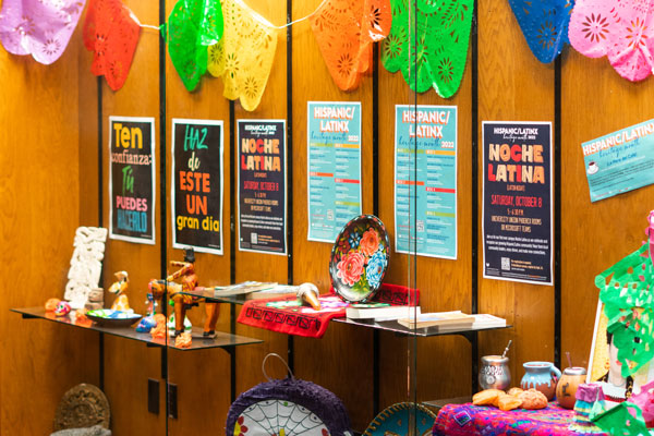 Posters in display case promoting Latinx events on campus