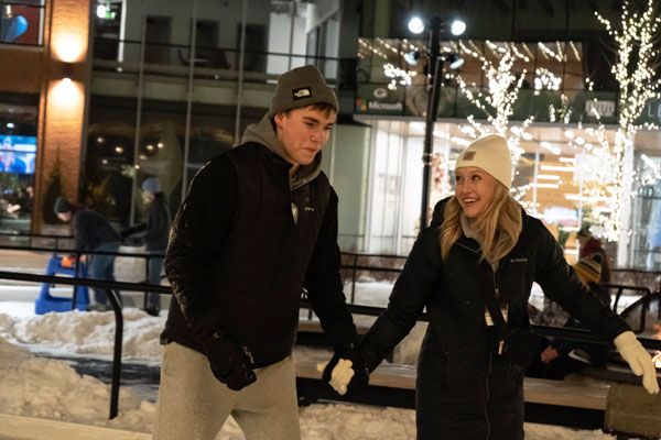 Two students ice skating at Titletown