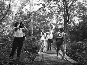 The University's arboretum trails provide abundant resource material for outreach students.