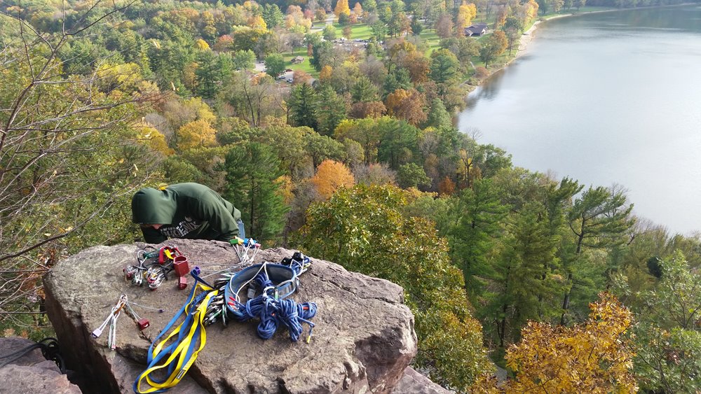 UREC Video still image of person readying a rock-climbing harness