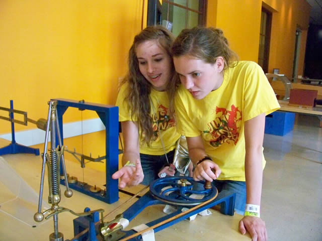 UWGB upward bound students using an interactive science display