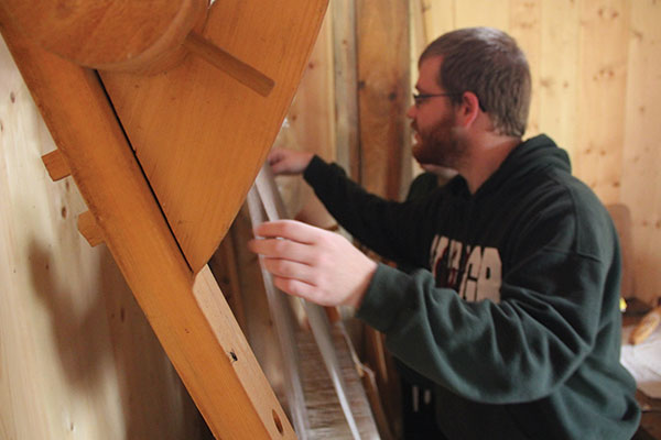 Student using a loom