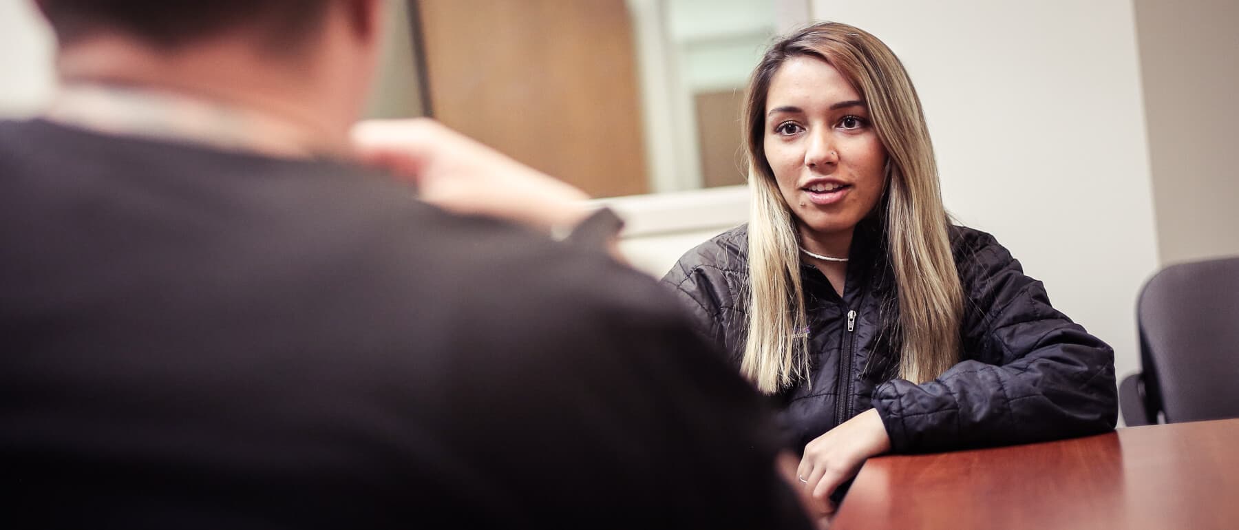 A UWGB student partakes in a mock interview for a Social Work class.