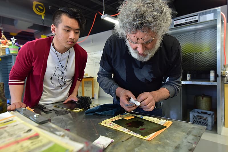 Professor Berel Lutsky of UWGB, Manitowoc campus in the printmaking studio with a student.