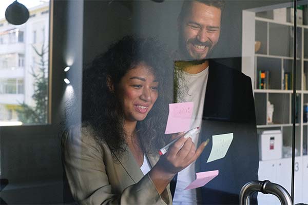 Coworkers doing a post-it note exercise