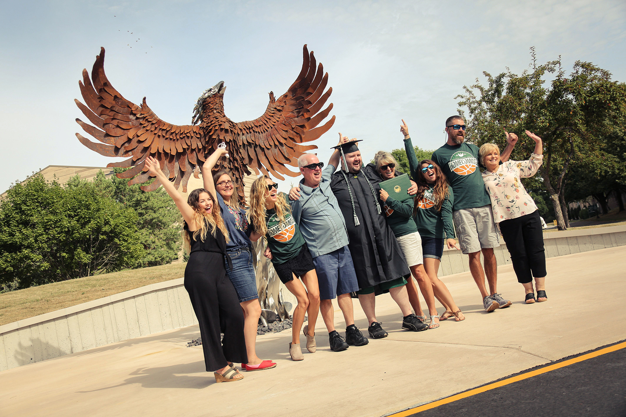 Graduate and friends celebrating with family