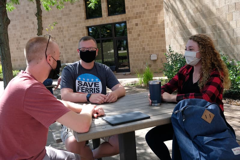 green bay students having coffee socially distant