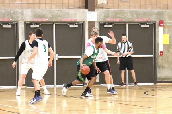 Student play intramural basketball at the Rec Center