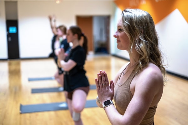 Students attend yoga class at the Rec Center