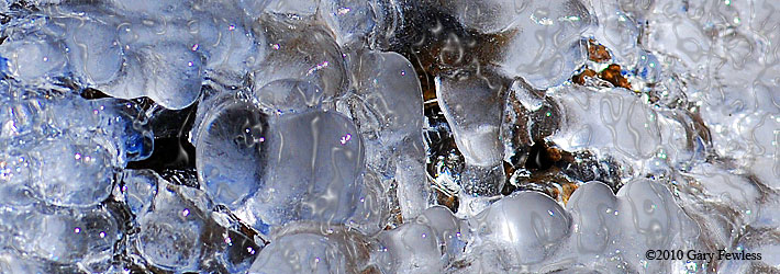 ice formed from spring water bubbling over rocks