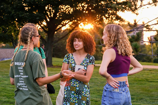 Female students talking outside on campus