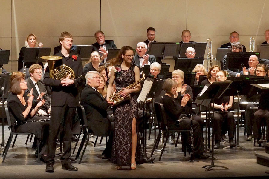 Young artists on stage with ensemble