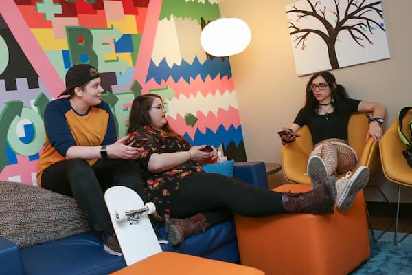 Student sitting in the Pride Center