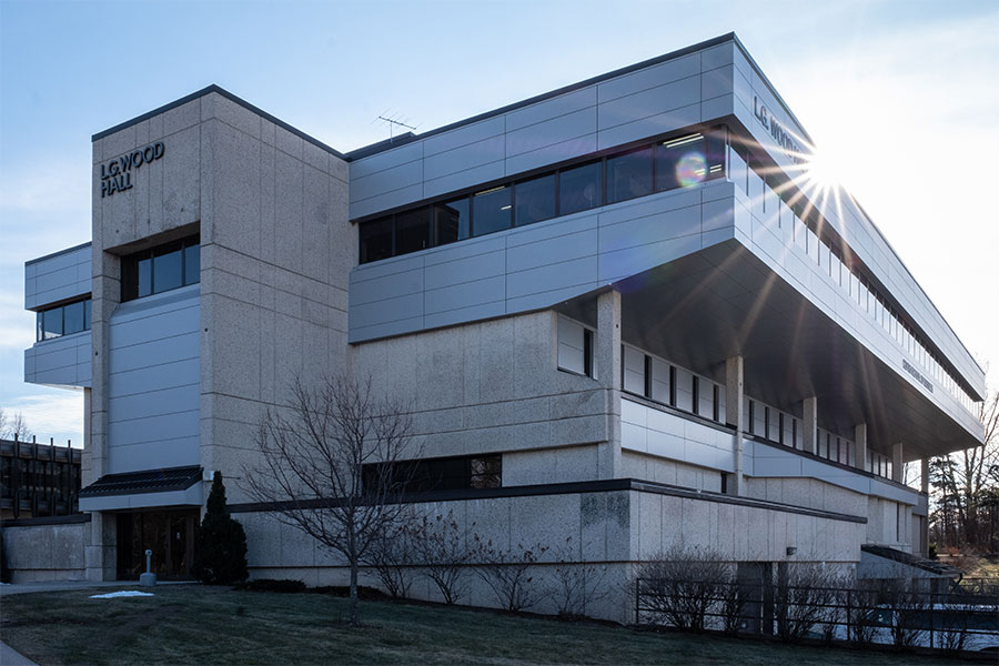 Sunlight glinting of the remodeled exterior of WoodHall