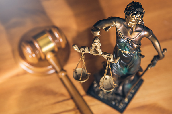 Gavel and lady justice statue