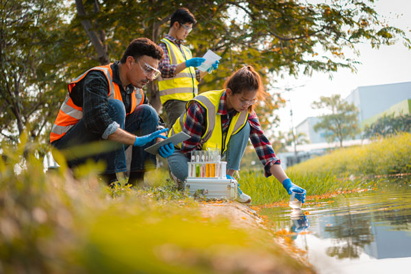 Group of scientist collecting water samples