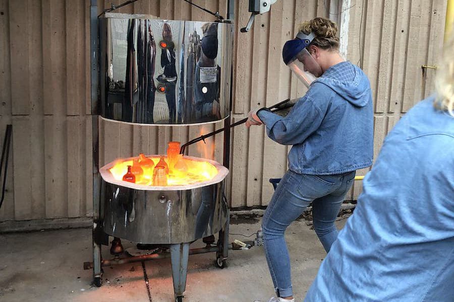 Student practices raku firing