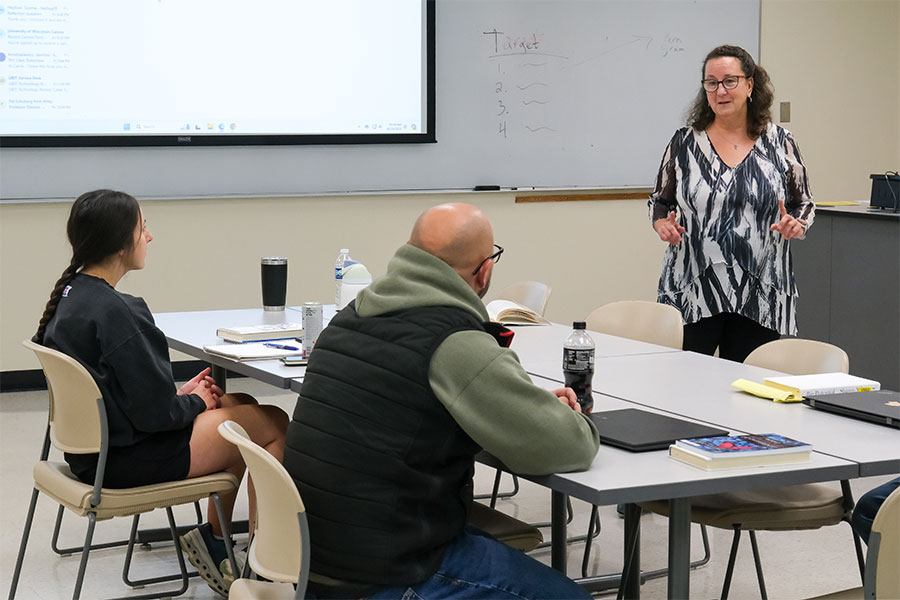 Instructor leads a graduate class discussion on responsive classroom behavior tools.