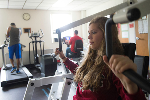 Students working out in exercise room