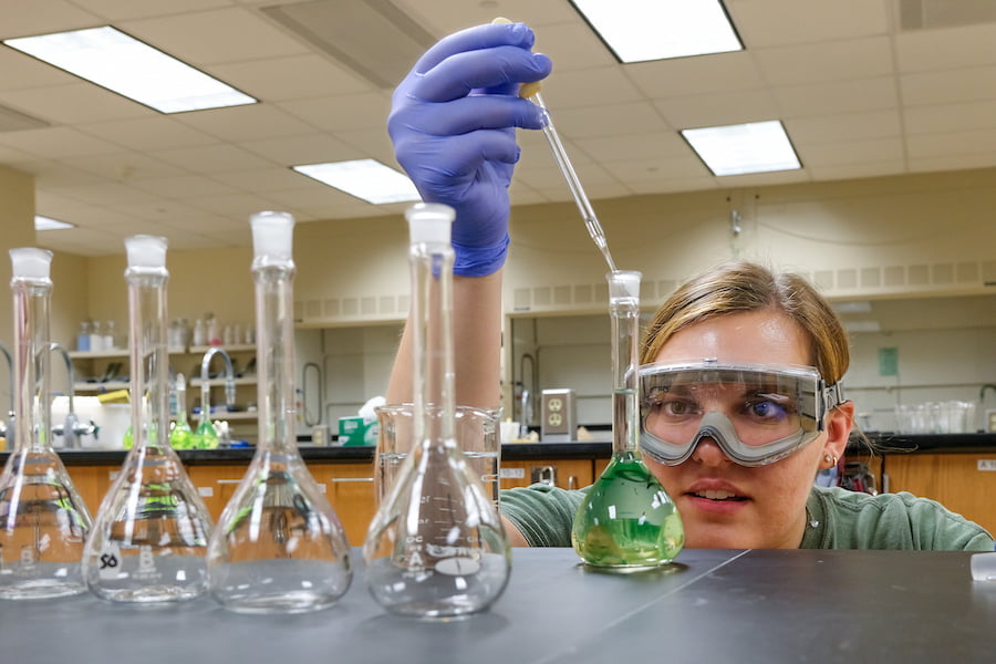 student conducting science experiment