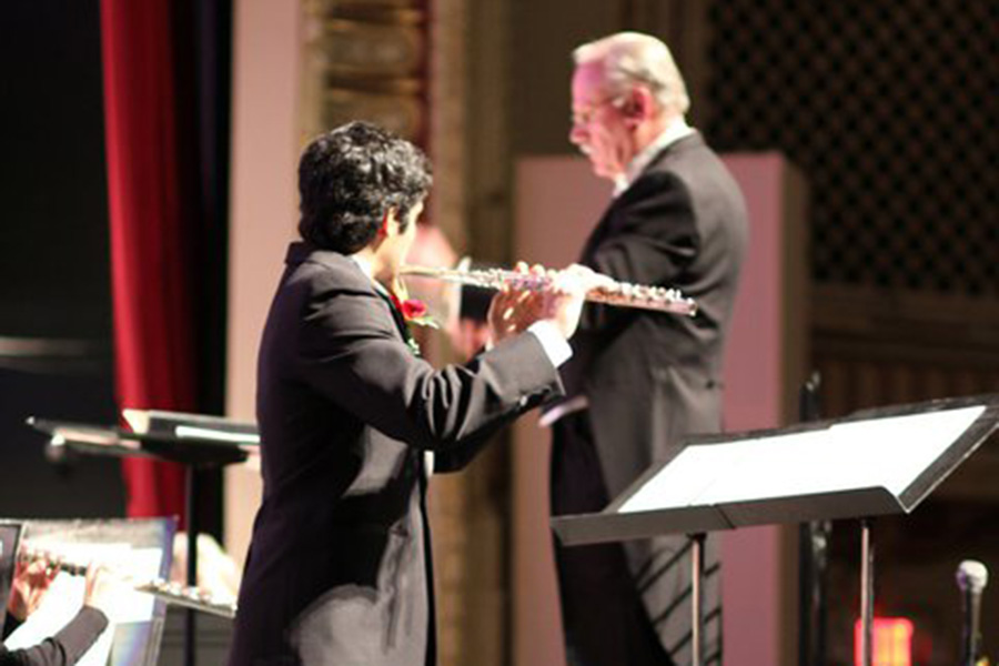 Solo Flutist and conductor on stage