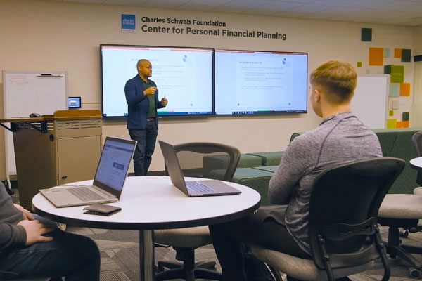 Professor teaching financial wellness