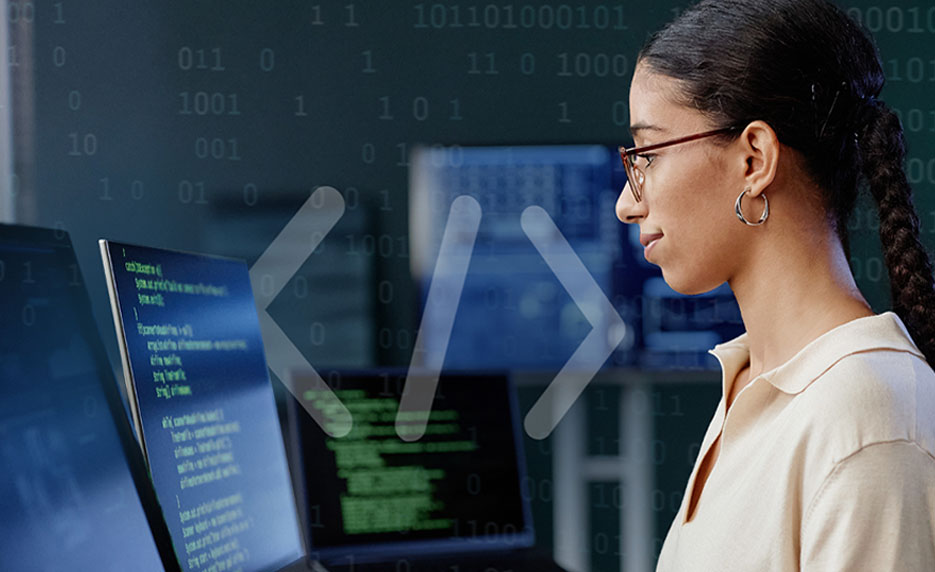 a woman staring at a computer screen with a coding symbol