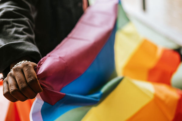 Close up of African American holding pride flag